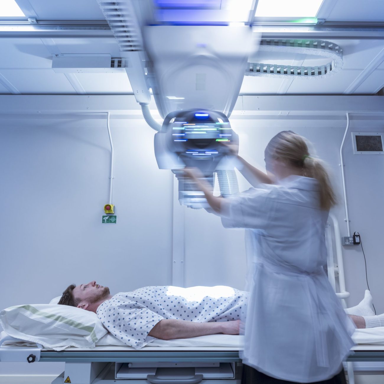 Radiologist setting up x-ray machine in hospital